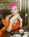 Elegant woman wearing THE ISABELLE wrist day gloves in yellow.