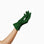 A woman's hand delicately holding THE ISABELLE - Green Day Glove - Holiday Edition by LadyFinch, perfect for spreading holiday cheer. These gloves are designed with touchscreen index fingers, ensuring convenience and functionality.