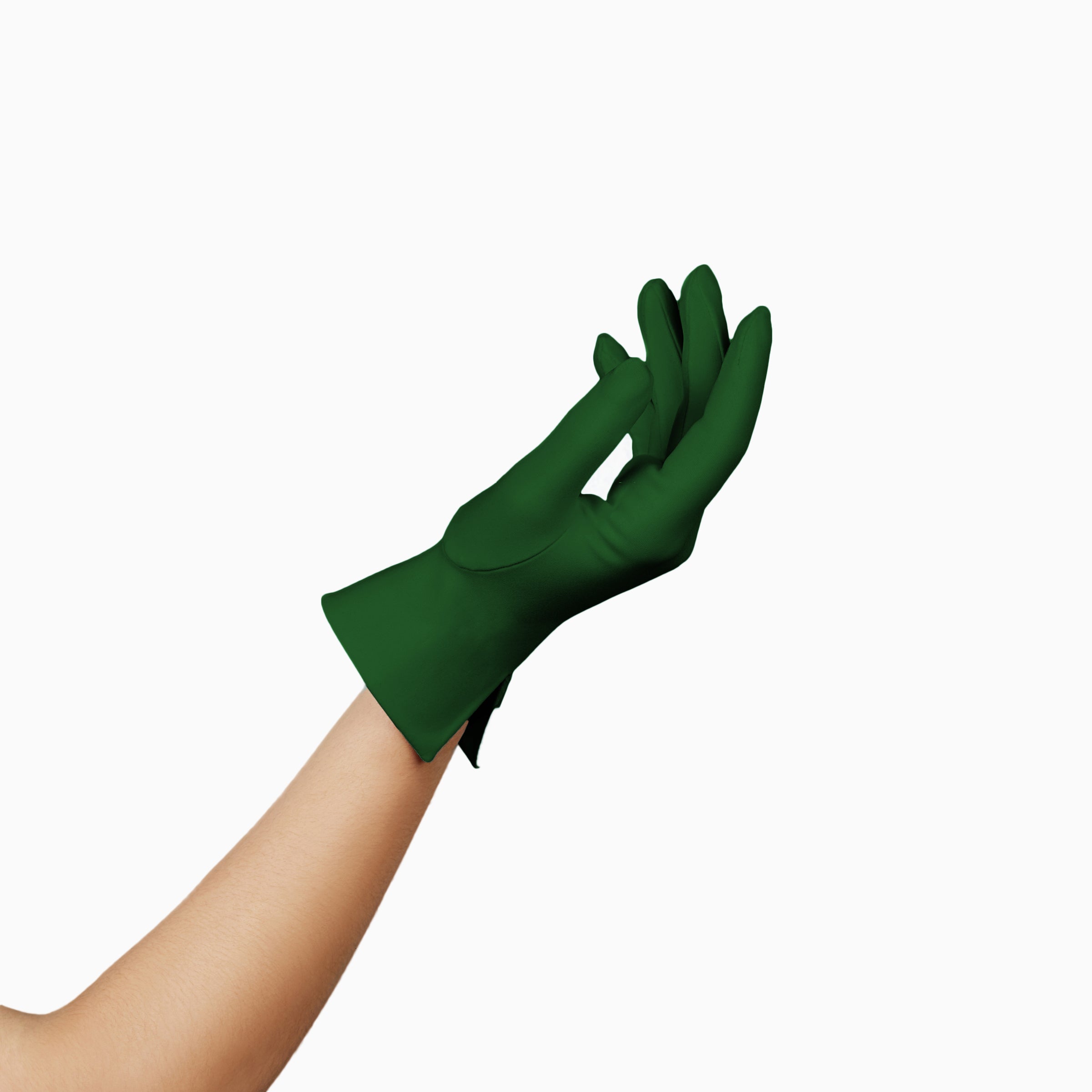 A woman's hand delicately holding THE ISABELLE - Green Day Glove - Holiday Edition by LadyFinch, perfect for spreading holiday cheer. These gloves are designed with touchscreen index fingers, ensuring convenience and functionality.