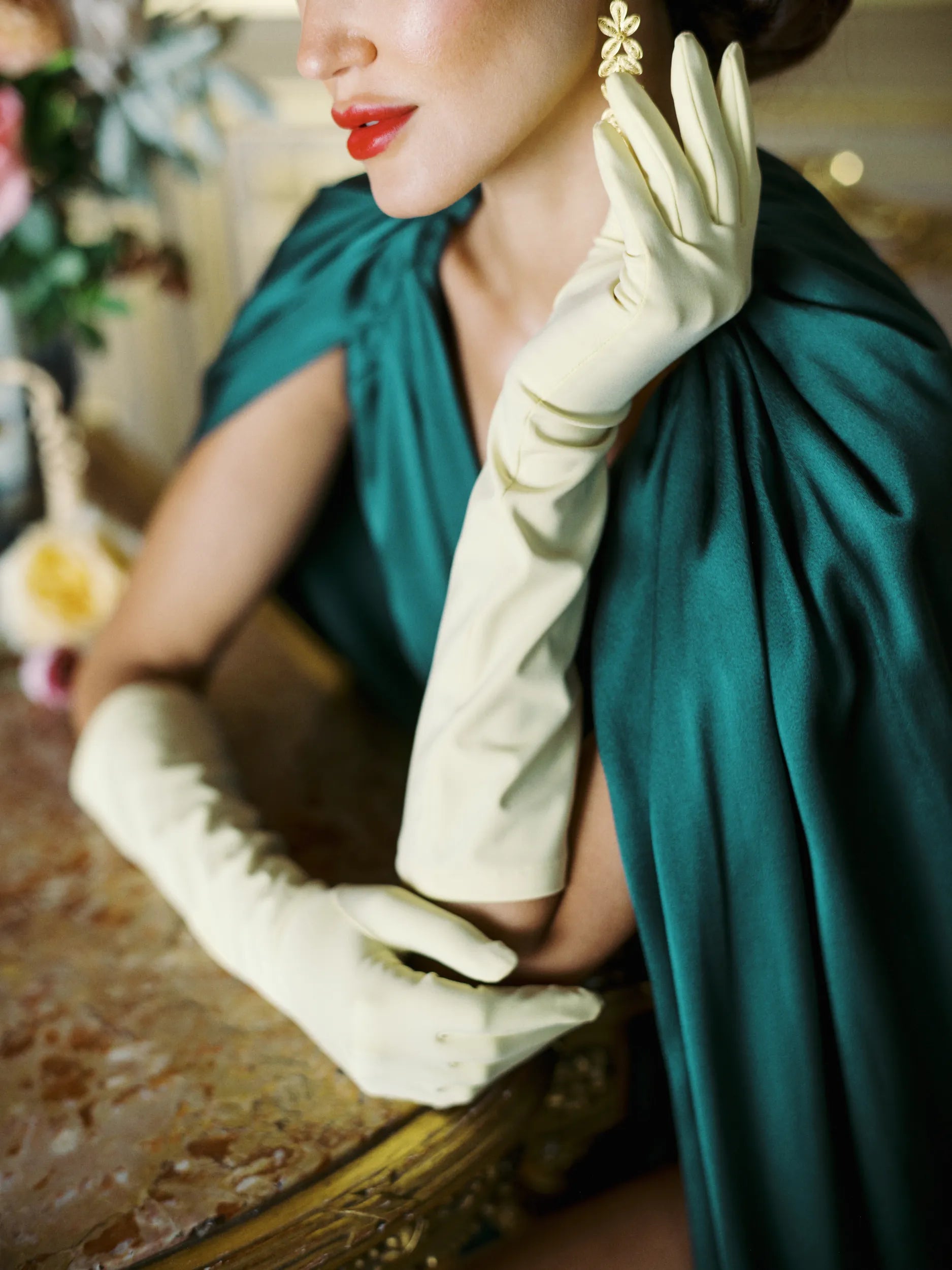 Glamorous woman wearing THE JILL glove in yellow.