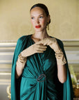 Women wearing green dress and beige glamorous Jill gloves in beige.