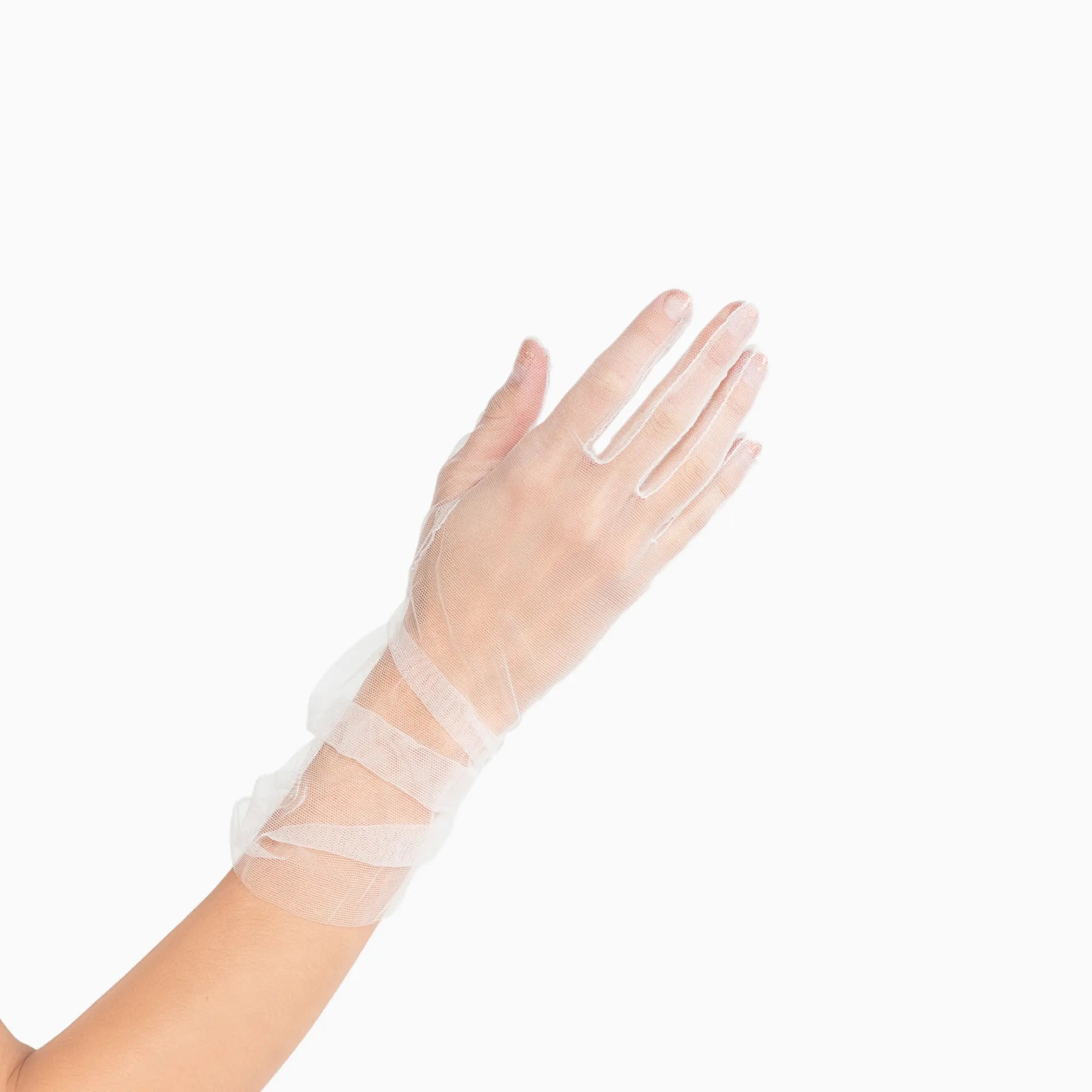 Womans hand wearing white tulle mid length ruched gloves.