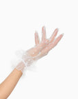 Woman wearing white tool, polkadot, wrist, length gloves