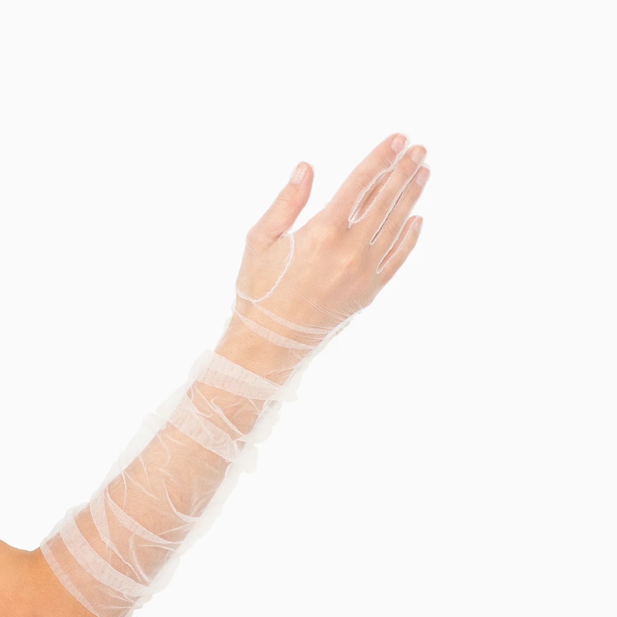 Woman's hand wearing elbow length ruched tulle white gloves.