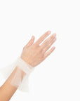 Women's hand wearing tulle white glove with ruched cuff