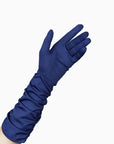 A woman's hand showing the Stefanie elbow length, dark blue gloves with palm open.