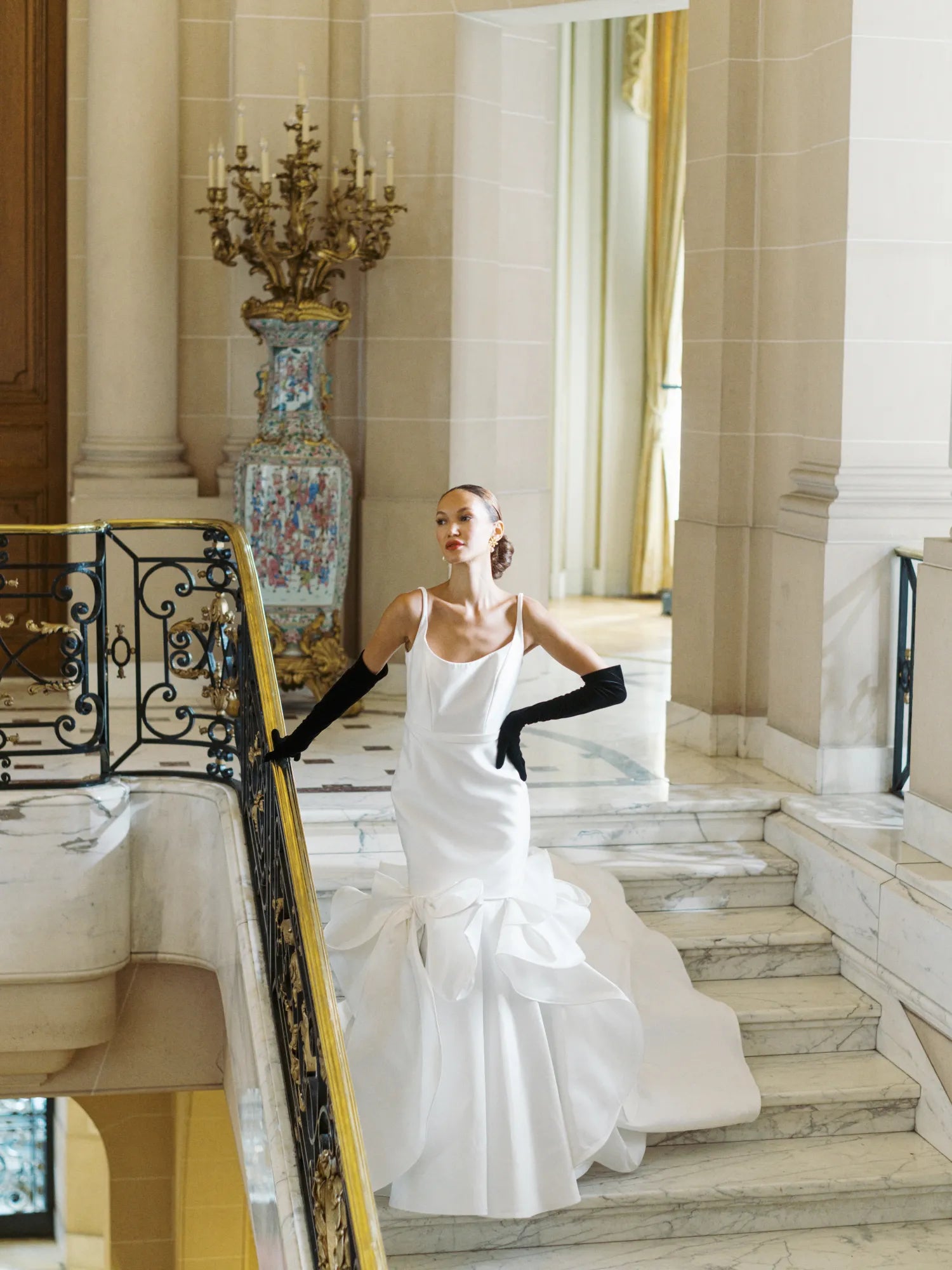 Bride in modern dress wearing opera black long gloves.