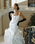 Bride posed with hand on hip, wearing opera long black velvet gloves.