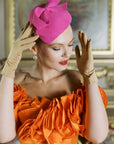 Glamorous woman touch head with beige ISABELLE gloves.