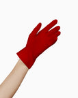 A woman's touchscreen hand in LadyFinch's THE ISABELLE - Red Day Glove - Holiday Edition.