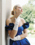 Women touch her neck wearing white formal THE JILL gloves.