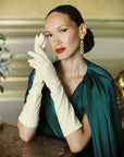 Elegant woman wearing THE JILL gloves in yellow.