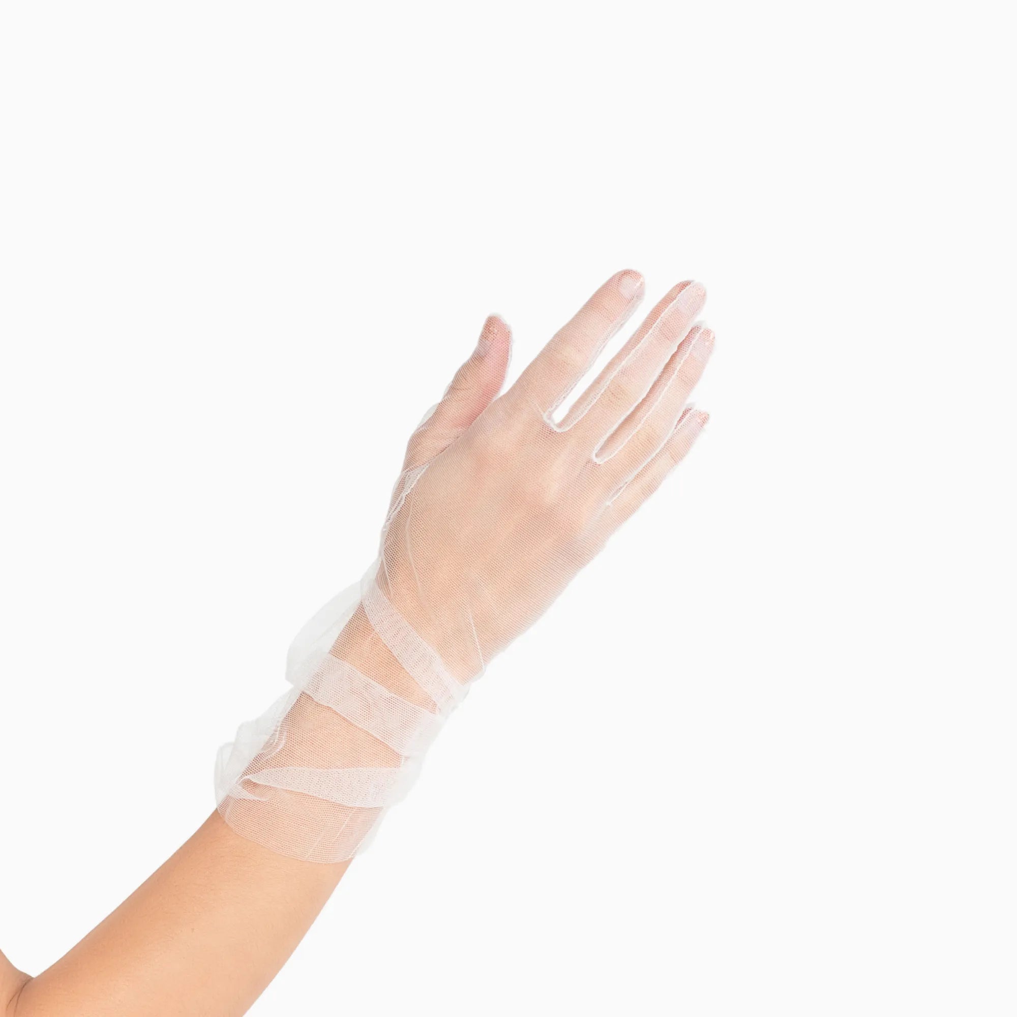 Womans hand wearing white tulle mid length ruched gloves.
