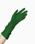 An elegant woman donning THE JILL - Green Mid Length Glove - Holiday Edition gloves from LadyFinch.