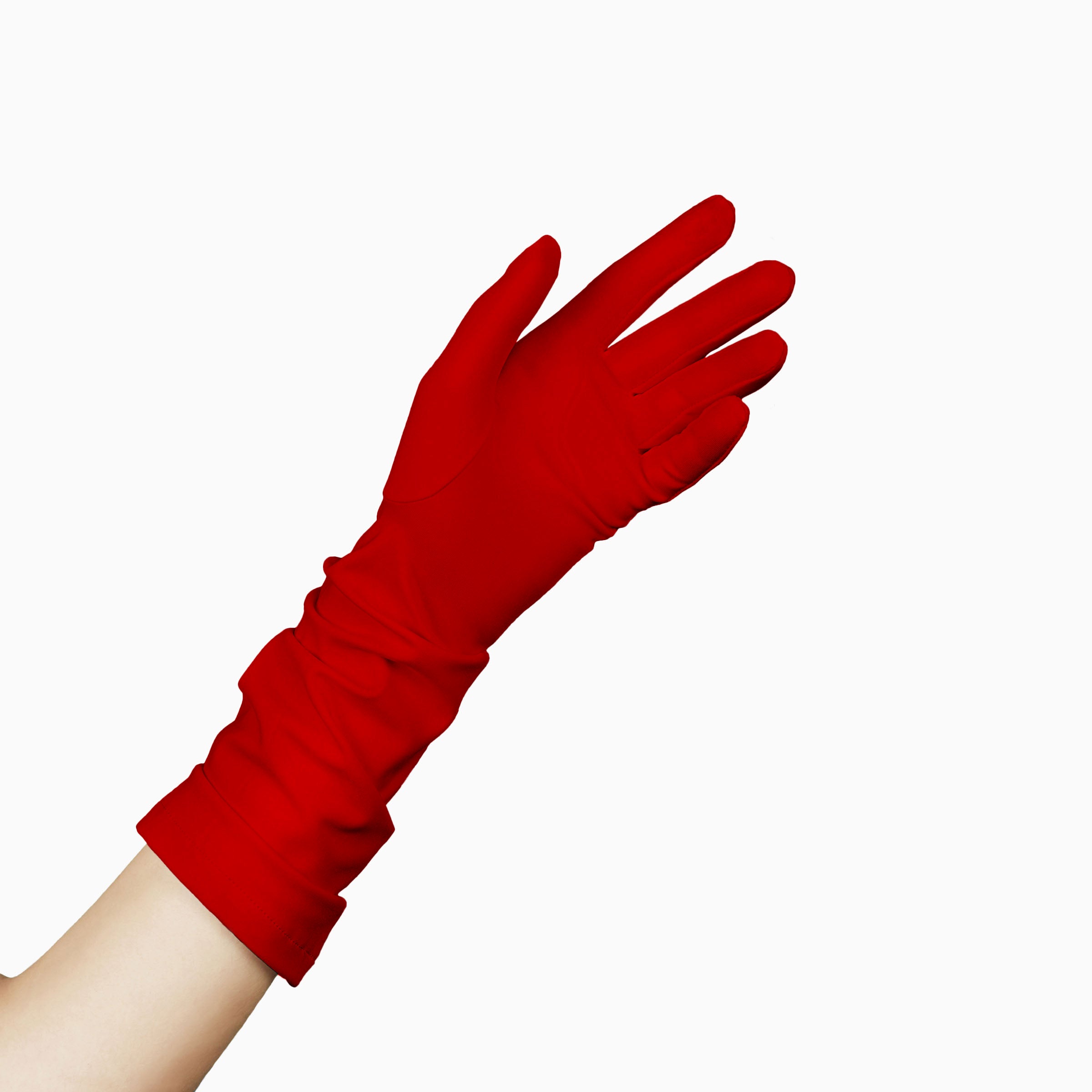 A woman&#39;s hand is holding THE JILL - Red Mid Length Glove - Holiday Edition by LadyFinch with ruched detailing.