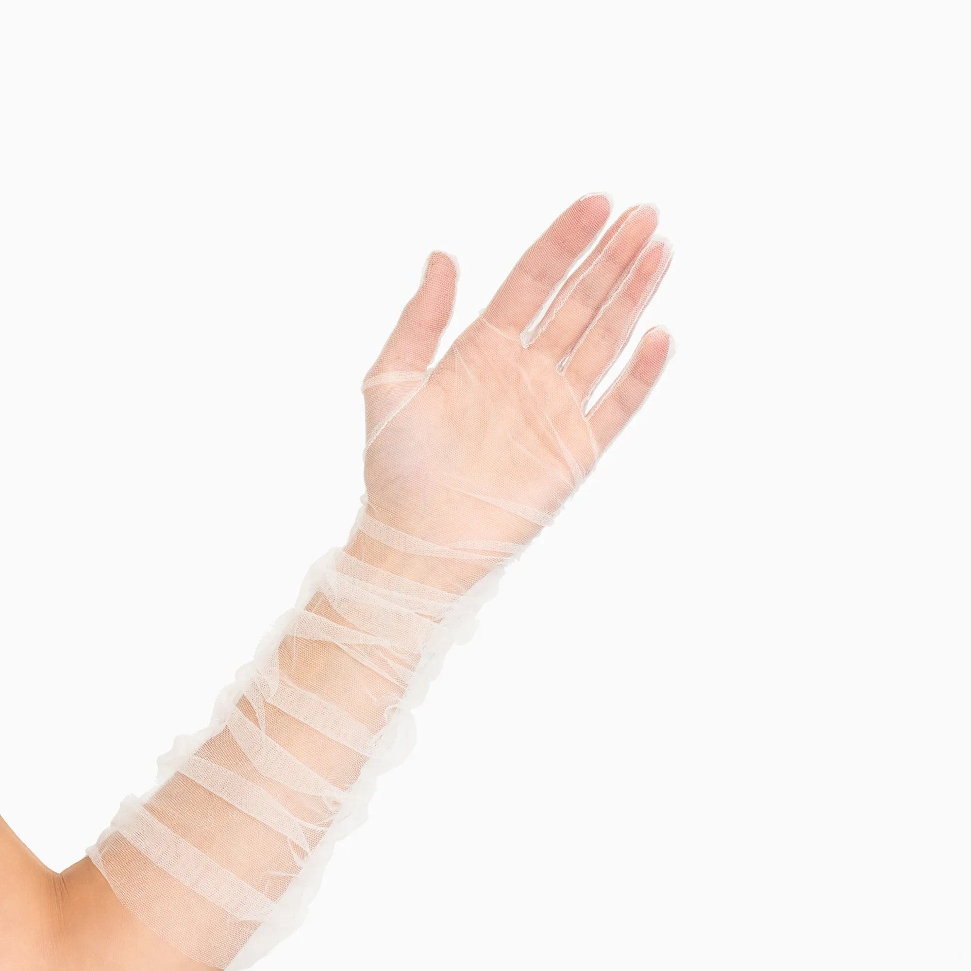 Woman&#39;s hand wearing elbow length ruched tulle white gloves.