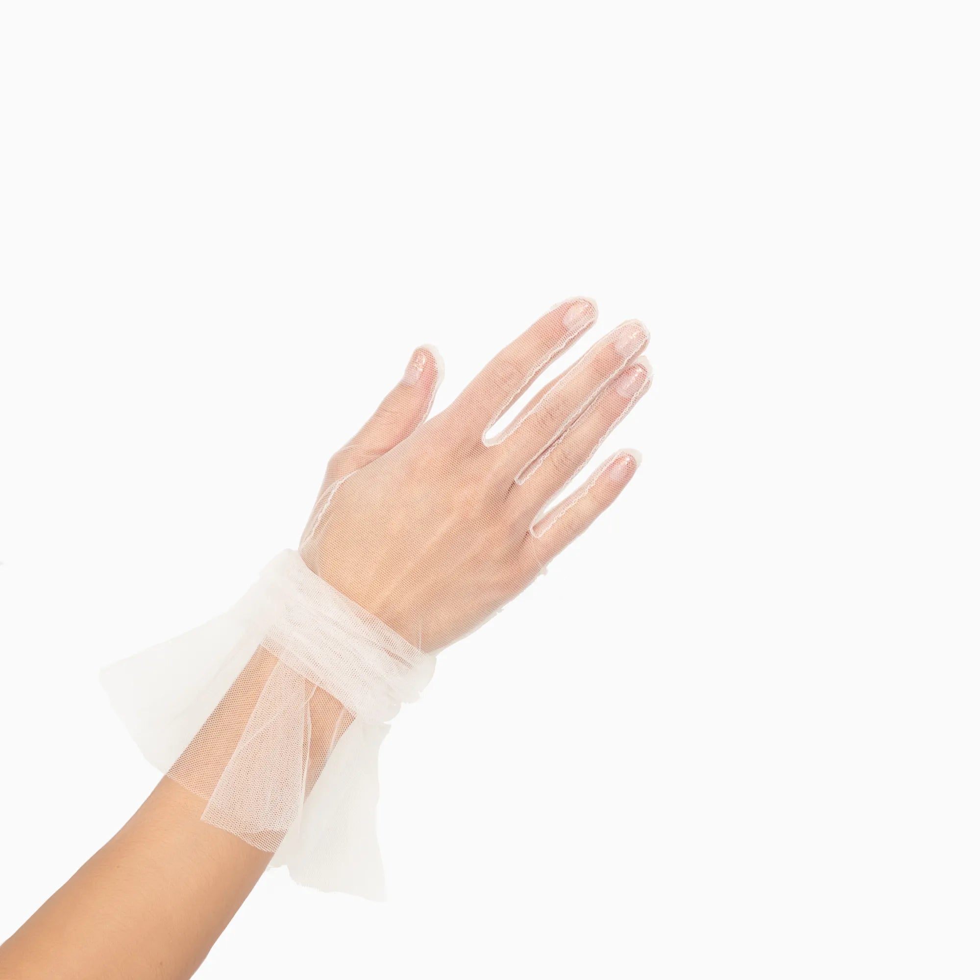 Women's hand wearing tulle white glove with ruched cuff