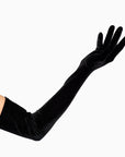 Black velvet opera gloves over the elbow.