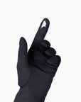 Black women's glove against white background showing technology friendly index finger.